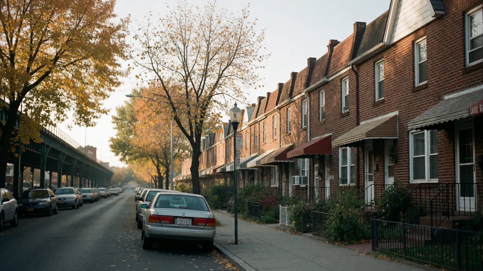 A residential street of brick rowhouses in Woodside, Queens, New York